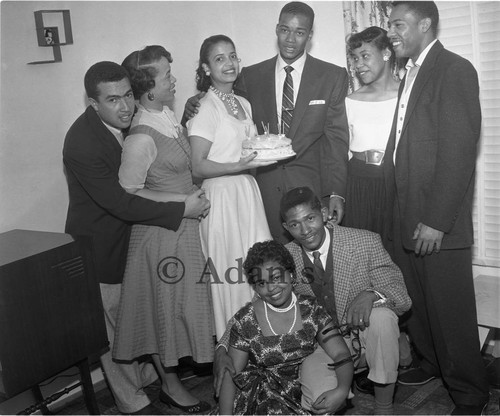 Men and women pose with a cake, Los Angeles, 1955