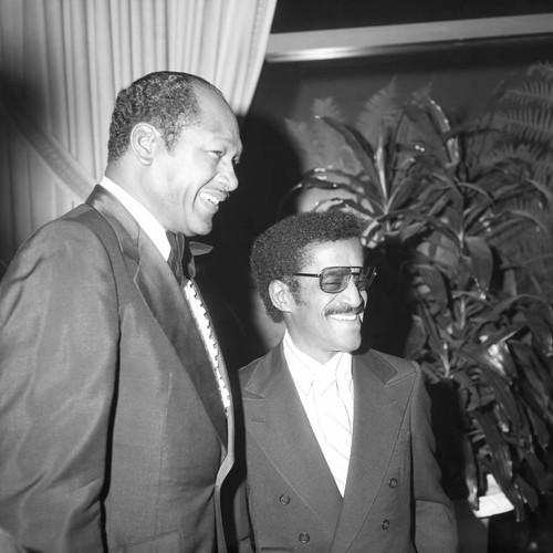 Tom Bradley standing with Sammy Davis, Jr. during a Golden Day School event, Los Angeles, 1986