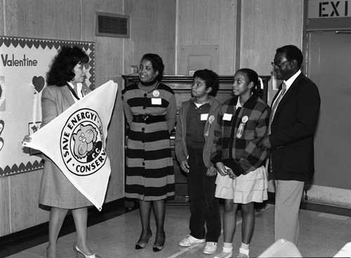 Woman discussing an energy conservation program with students, Los Angeles, 1986