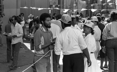 Friends feeding friends, Los Angeles, 1986