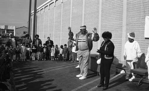 Rosey Grier participating in a Head Start Toy Lift event, Los Angeles, 1993