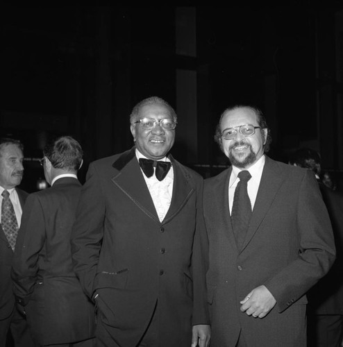 Dr. Kenneth Washington posing with an unidentified man at an event for Mayor Bradley, Los Angeles, 1974