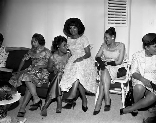 La Doris McClaney celebrating with others during a wedding shower, Los Angeles, 1960