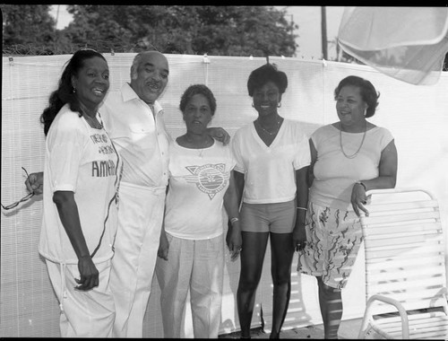 Four African American women and an African American man posing on a patio, Los Angeles, 1988