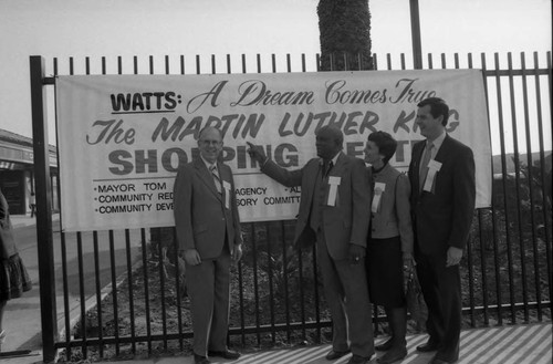 Kenneth Hahn and others posing at the Martin Luther King Jr. Shopping Center opening, Los Angeles, 1984