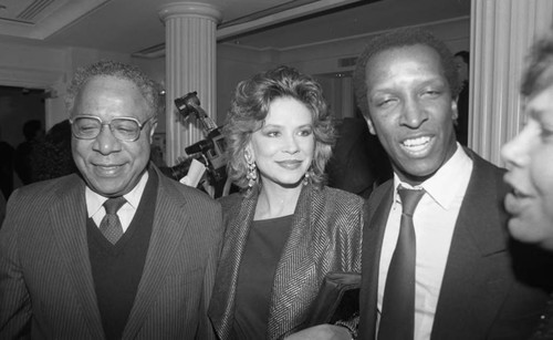 Alex Haley talking with Nancy and Dorian Harewood, Los Angeles, 1987