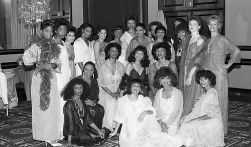 Fantasy in Dreamland fashion show participants posing together, Los Angeles, 1986