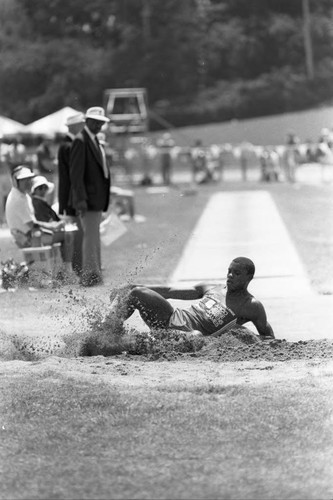 Carl Lewis completing a long jump, Los Angeles, 1982