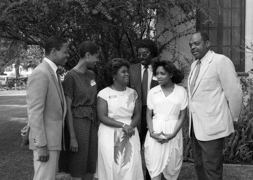 Walt Hazzard standing with a group of people, Los Angeles, 1985