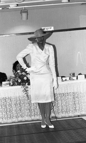 Model posing on the runway during a graduation and fashion show, Los Angeles, 1986