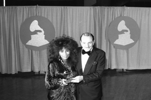 Chaka Khan and Arif Mardin posing with their Grammy at the 26th Annual Grammy Awards, Los Angeles, 1984