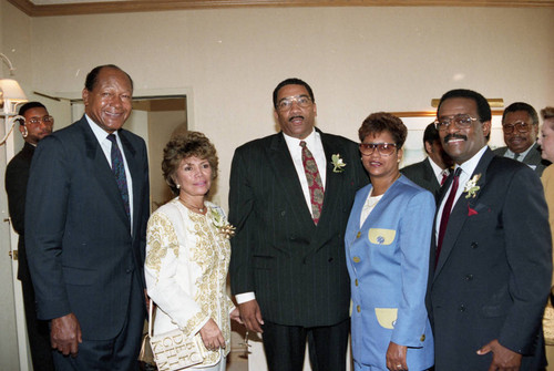 Tom Bradley and Willie and Evelina Williams posing with others, Los Angeles, 1992