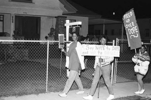 Neighborhood watch group marching against drugs and crime, Los Angeles, 1986