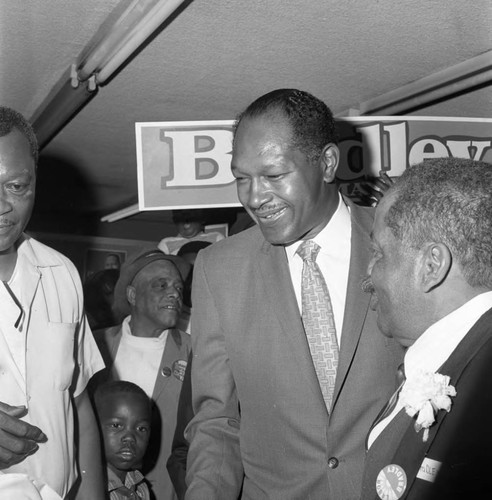 Tom Bradley greeting a crowd of supporters during his mayoral campaign, Los Angeles, 1969