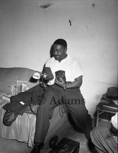 Man with camera, Los Angeles, 1955