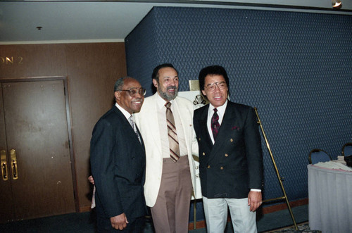 Rev. Cecil Murray, Rev. O. C. Smith, and Kenneth Thomas posing together at the National Newspapers Publishers Association convention, Los Angeles, 1993