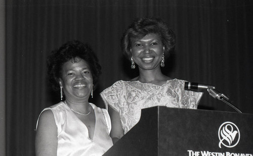 Alpha Kappa Alpha Sorority sisters posing together at a lectern, Los Angeles, 1984