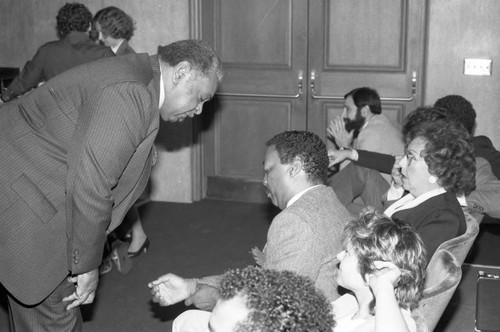 Paul Winfield talking with others during a meeting on homelessness, Los Angeles, 1986