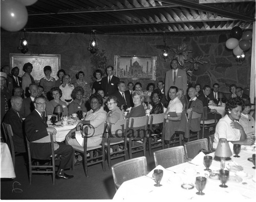 Men and women in dining establishment, Los Angeles, 1964