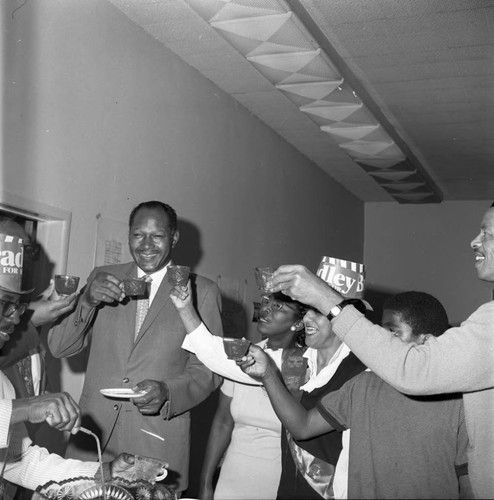 Tom Bradley and others toasting each other during his mayoral campaign,, Los Angeles, 1969