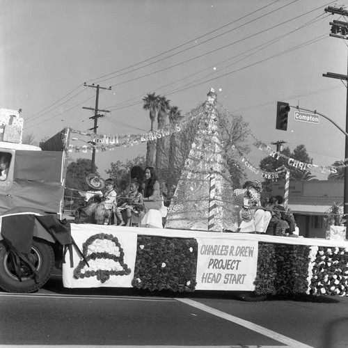 Watts Christmas Parade float for Project Head Start passing along the route, Los Angeles, 1975