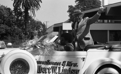 Gilbert Lindsay riding in car during the South Central Los Angeles Easter Parade, Los Angeles, 1983