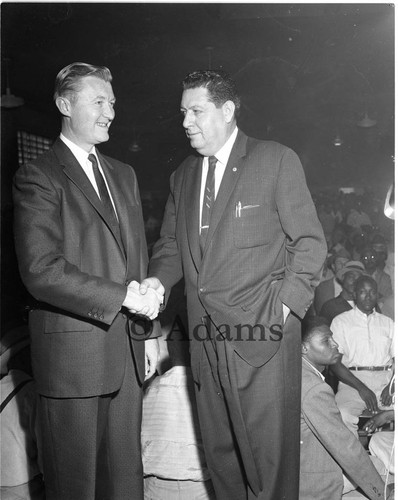 Two men shake hands, Los Angeles, 1958