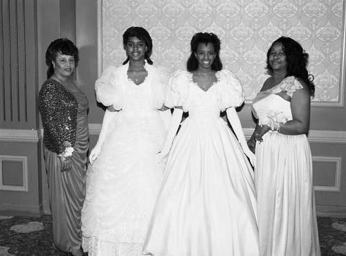 Ardell Jackson and Earlene Sanders posing with Phi Delta Kappa debutantes, Los Angeles, 1987