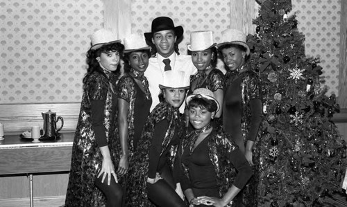 Gene Anthony Ray and other FAME dance troup members posing together at a First AME Banquet, Los Angeles, 1985