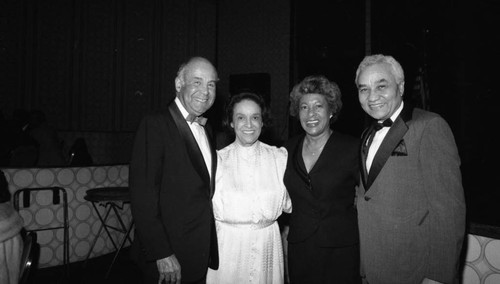 Dr. and Mrs. Laynard Halloman posing with Mr. and Mrs. Edward Tillmon at an awards dinner, Los Angeles, 1985