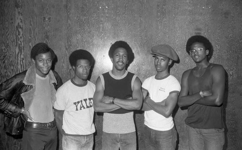 Young men posing together during a fashion show, Los Angeles