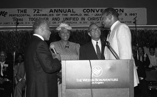 Tom Bradley talking with others at the 72nd Annual Pentecostal Assemblies of the World convention, Los Angeles, 1987