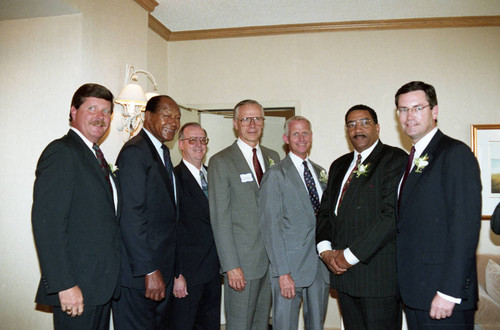 Willie Williams and Tom Bradley posing with others, Los Angeles, 1992