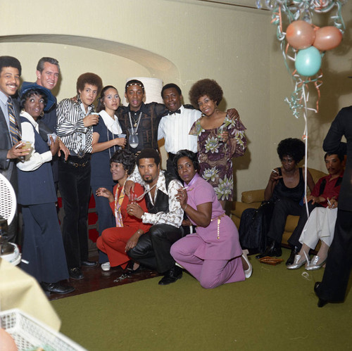 House party guests posing together at party, Los Angeles