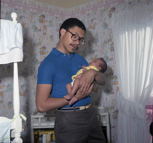 David Cunningham, III with an Infant, Los Angeles, 1982