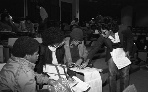 Advisors coaching students during a financial aid workshop, Los Angeles, 1983