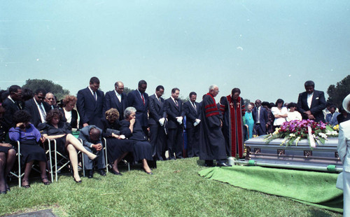 Funeral attendees at the grave site of Jessie Mae Beavers, Los Angeles, 1989