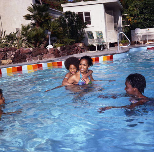 Iris Gordy and children in the pool at Berry Gordy's party, Los Angeles