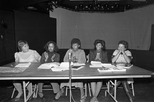 Women applauding during a panel discussion at Compton College, Compton, 1983