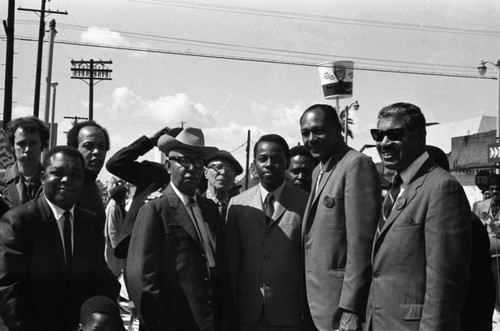 Tom Bradley posing with others during his mayoral campaign, Los Angeles, 1969