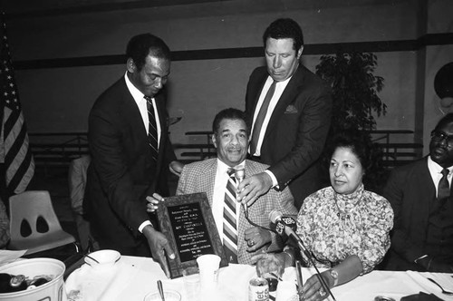 Ernie Banks presenting Roy Campanella with a plaque inducting him into the Black Athletes Hall of Fame, Los Angeles, 1984