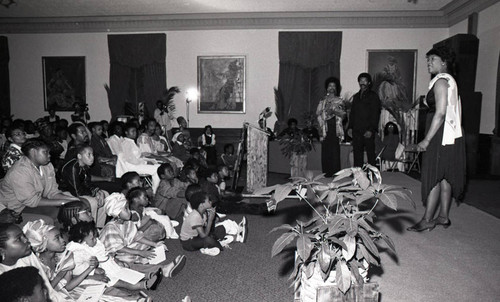 African Liberation Day audience listening to a speaker, Los Angeles, 1983