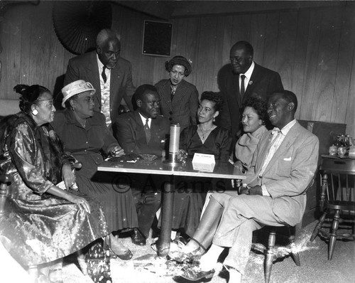 Men and women at a table, Los Angeles, ca. 1955