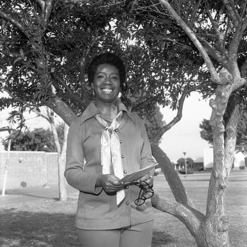 Young woman posing on the campus of Compton College, Los Angeles, 1972