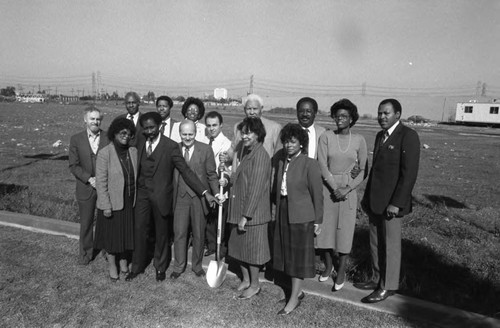 People posing together during a ground breaking ceremony, Compton, California, 1984