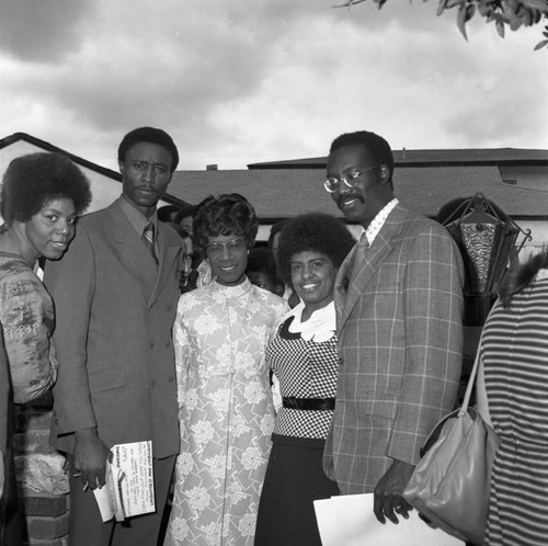 Shirley Chisholm posing with others during her visit to Compton College, Compton, 1972