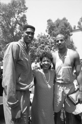 Maxine Waters posing with Charles Smith and Ken Norman at the Black Family Reunion, Los Angeles, 1989