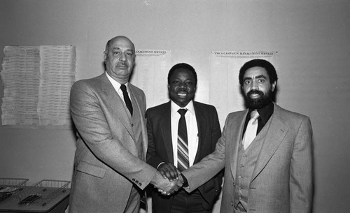 Virgil W. Hill, Jr., posing with Crenshaw Family YMCA Current Support Campaign participants, Los Angeles, 1983