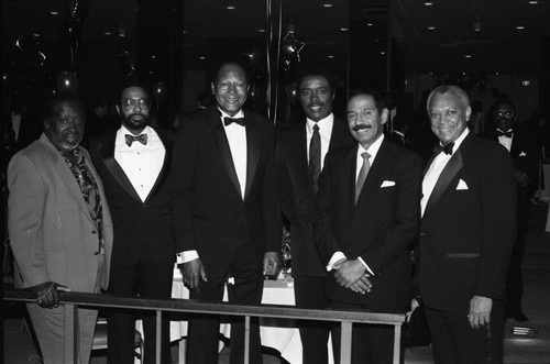 Tom Bradley posing with Clarence Avant, Jim Hill, and John Conyers, Los Angeles, 1989