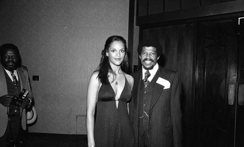 Jayne Kennedy posing with a member of the press at the NAACP Image Awards, Los Angeles, 1978